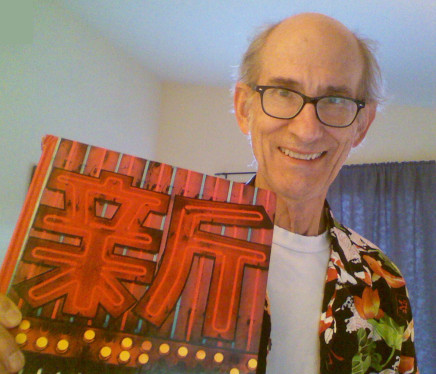 Rash holding a Tokyo book