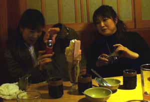 Asako and Mine photographing dessert