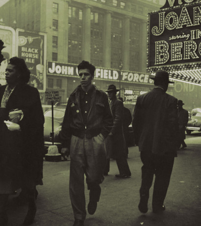 five people on the sidewalk near Times Square