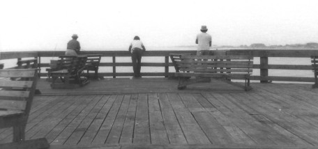 Fishin Three men at the rail, fishing (black&white)