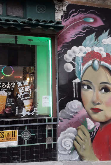 Storefront and mural in Chinatown SF