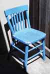 the old blue chair out on the patio